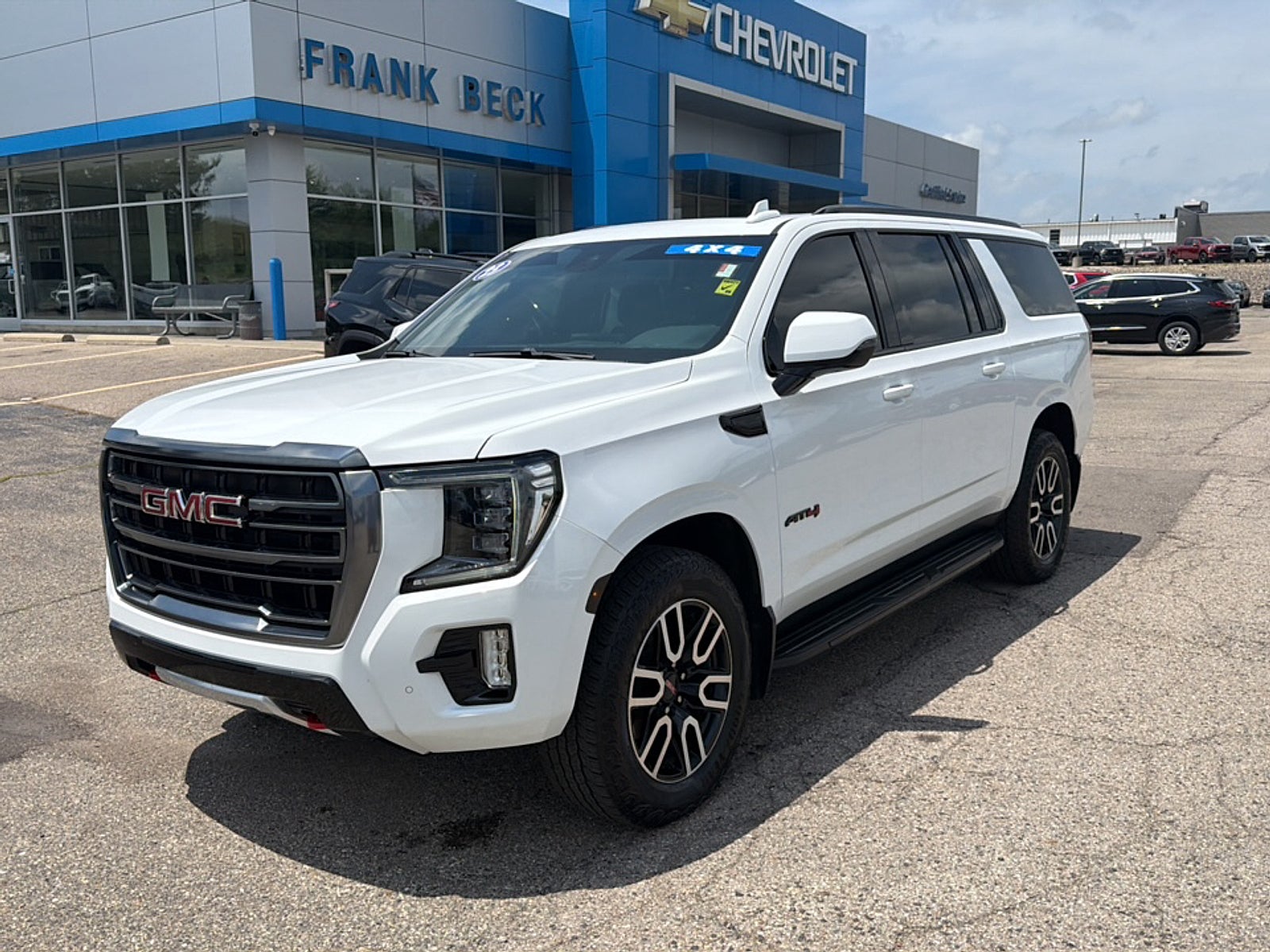 2023 GMC Yukon XL AT4 in Summit White — front three-quarter view