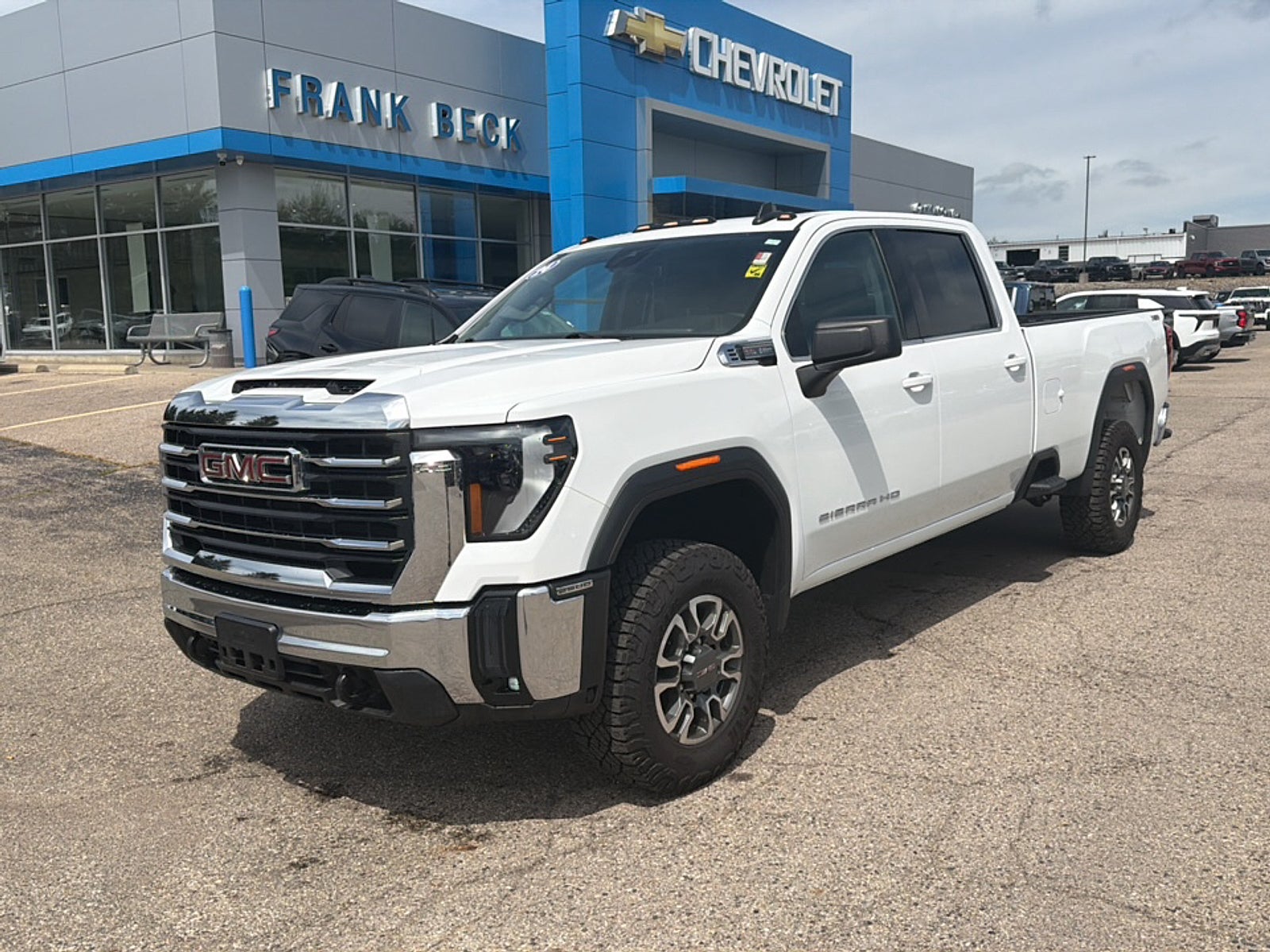 2024 GMC Sierra 2500 HD SLE in Summit White — front three-quarter view